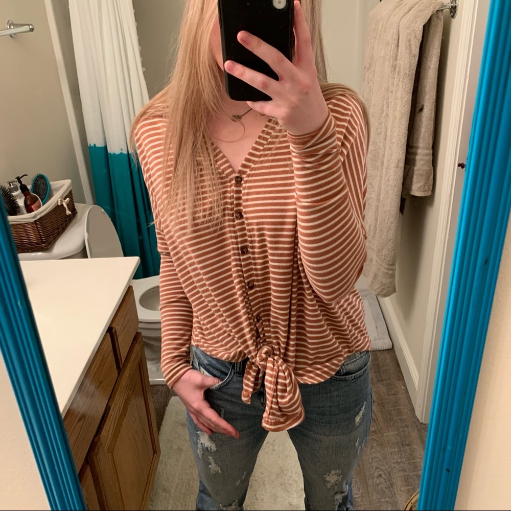 pink and white striped buttoned up sweater